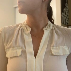 Super cute white blouse with embellishment